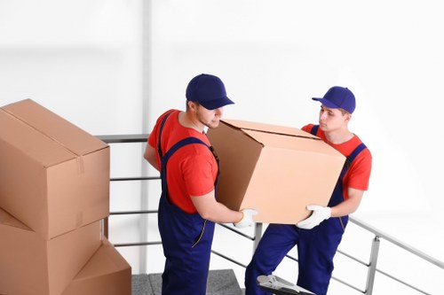 Packing boxes and fragile items for a local house removal