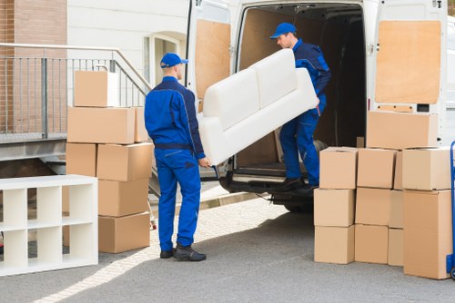 Boxes and household items prepared for transport from a village flat