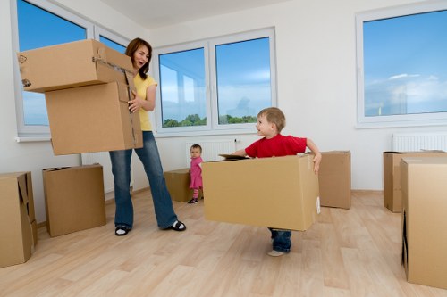 Careful loading of household furniture from a village street property