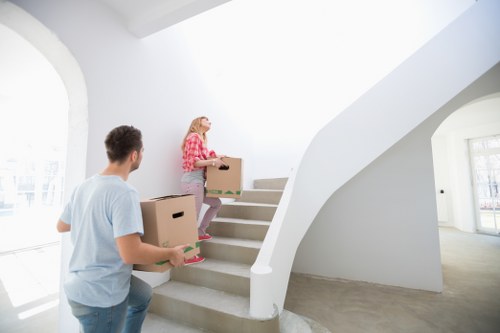 Prepared moving day scene with boxes, wrapping, and furniture protection