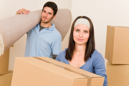 Business relocation setup with boxes, desks, and equipment ready for transport
