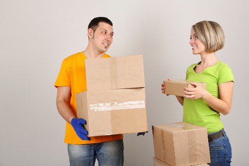 Furniture being loaded carefully into a van for transport